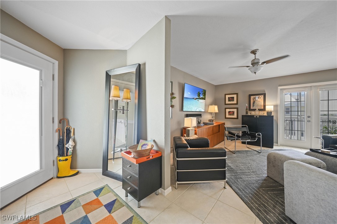 950 Moody Road, Unit 140 North Fort Myers, FL 33903 - Photo 23 of 46 a living room with furniture and a floor to ceiling window