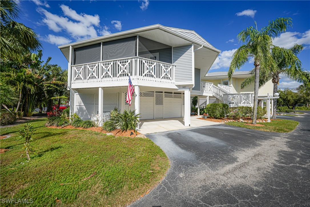 950 Moody Road, Unit 140 North Fort Myers, FL 33903 - Photo 39 of 46 a front view of a house with a yard
