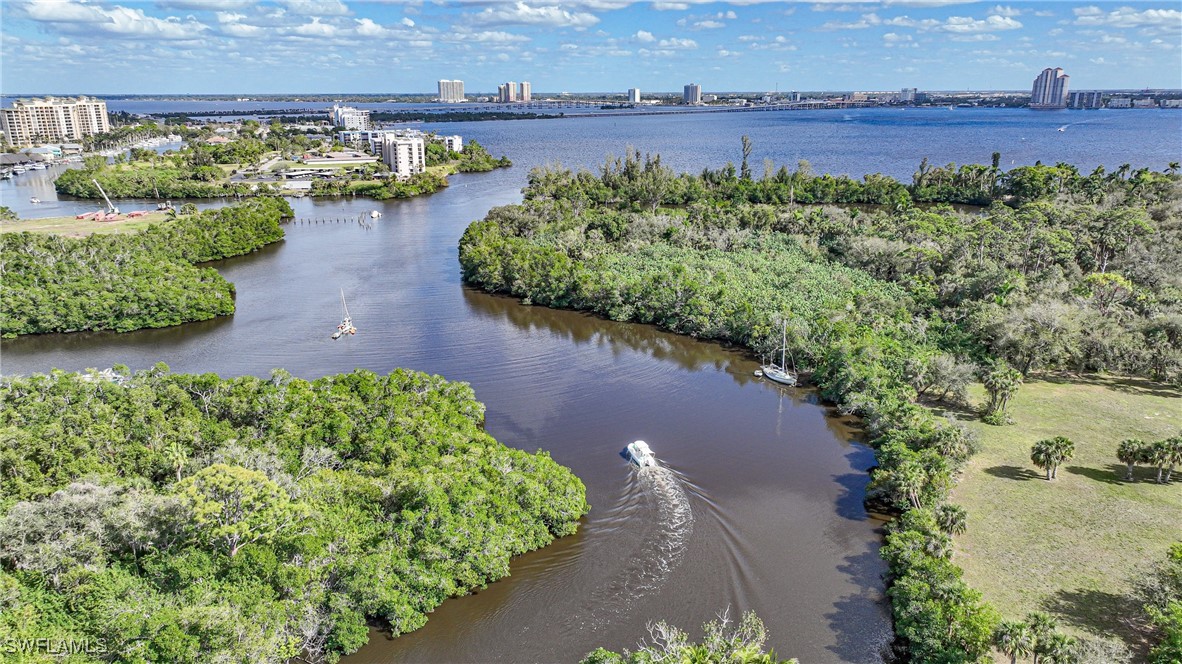 950 Moody Road, Unit 140 North Fort Myers, FL 33903 - Photo 42 of 46 an aerial view of a house with a yard and lake view