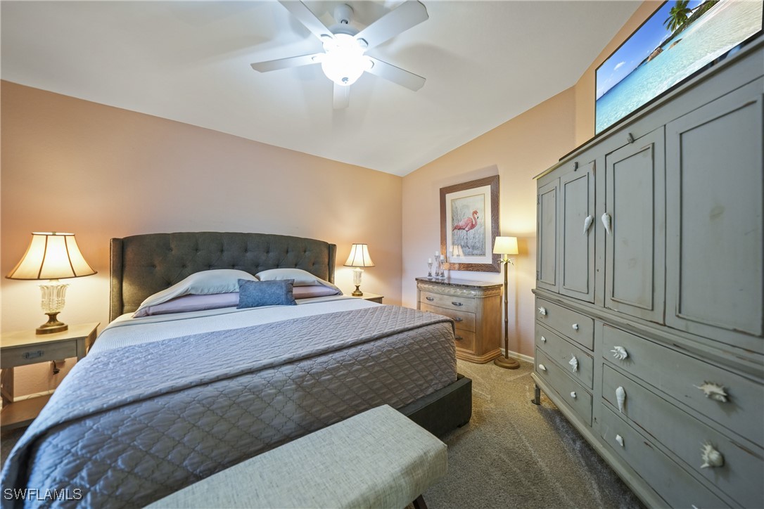 950 Moody Road, Unit 140 North Fort Myers, FL 33903 - Photo 6 of 46 a spacious bedroom with a bed and a cabinets