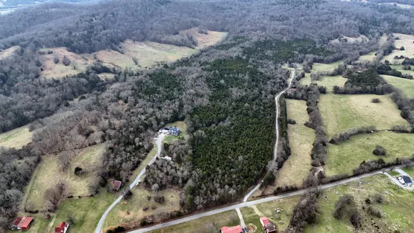 an aerial view of residential house with outdoor space