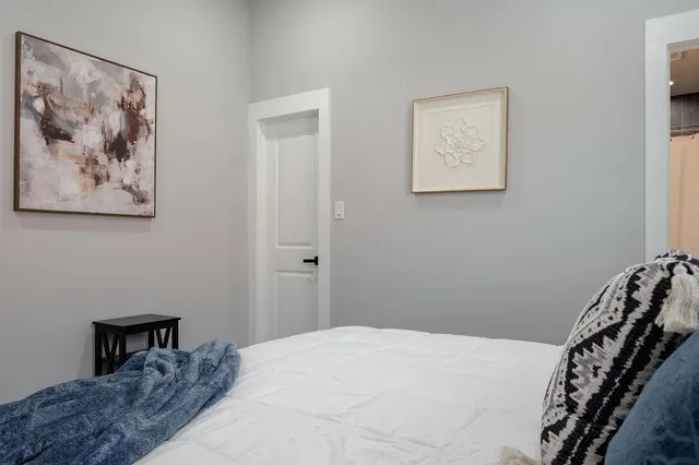 a bathroom with a sink vanity mirror and toilet