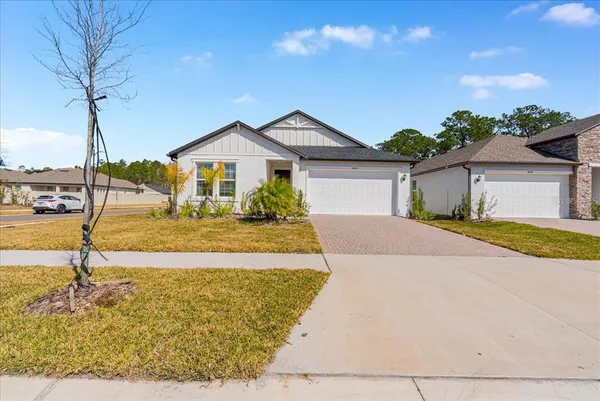 a front view of a house with yard
