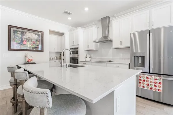 a kitchen with sink and cabinets
