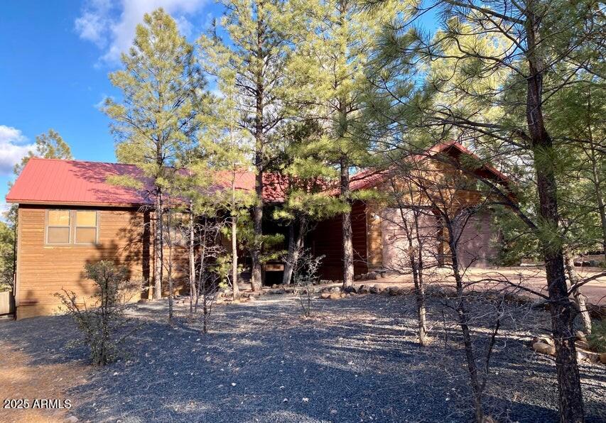 1100 South Pinon Drive Show Low, AZ 85901 - Photo 1 of 30 a view of road with trees