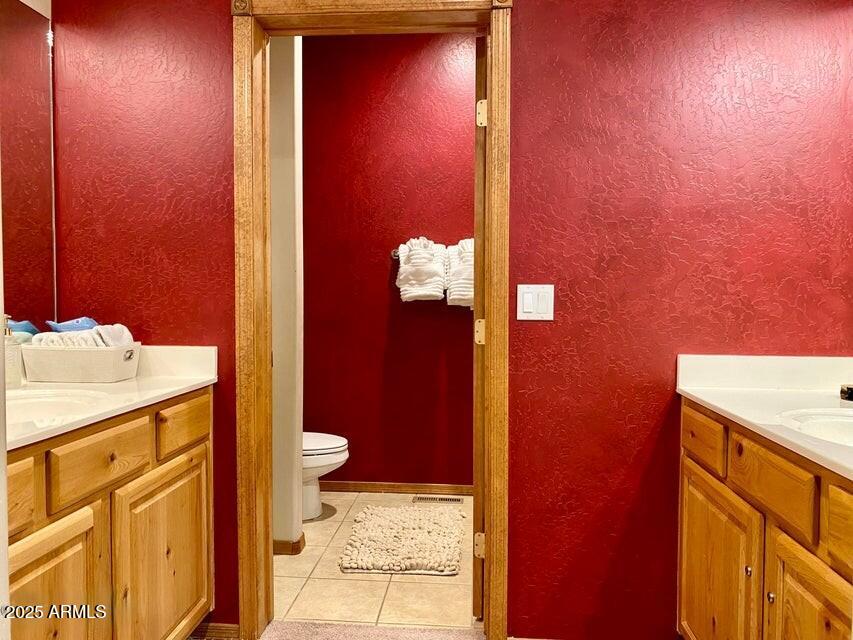 1100 South Pinon Drive Show Low, AZ 85901 - Photo 15 of 30 a bathroom with a sink and a mirror