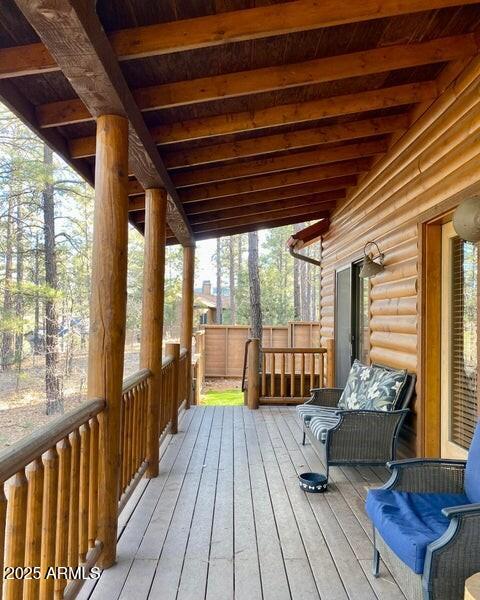 1100 South Pinon Drive Show Low, AZ 85901 - Photo 25 of 30 a balcony with wooden floor and outdoor seating