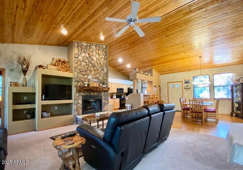1100 South Pinon Drive Show Low, AZ 85901 - Photo 9 of 30 a living room with fireplace furniture and a flat screen tv