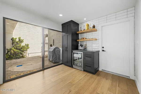 a open kitchen with stainless steel appliances kitchen island a stove a sink a refrigerator and a refrigerator