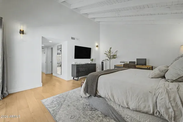 a bathroom with a shower sink and mirror