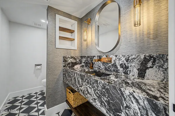 a view of a walk in closet with clothes