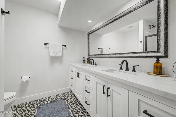 a bedroom with a bed and a dresser