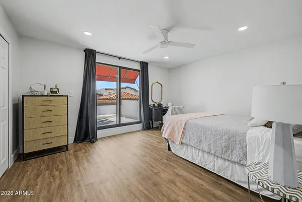 a living room with furniture and a piano