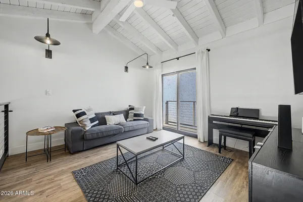 a view of a balcony with chair and table