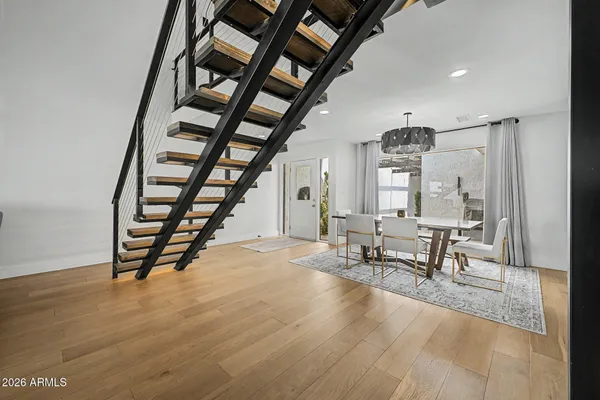a view of a dining room with furniture and wooden floor