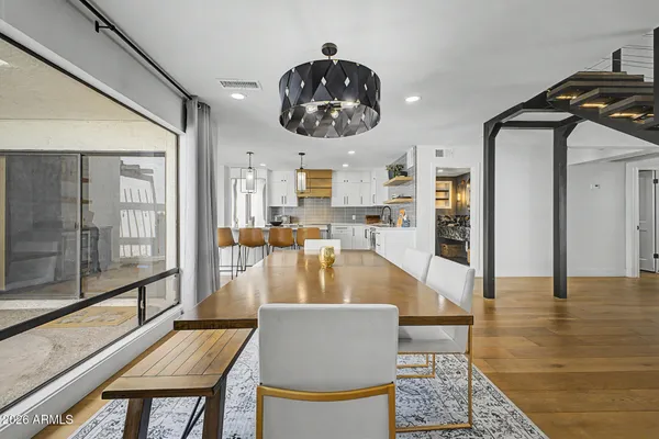 a kitchen with stainless steel appliances granite countertop a refrigerator and a stove