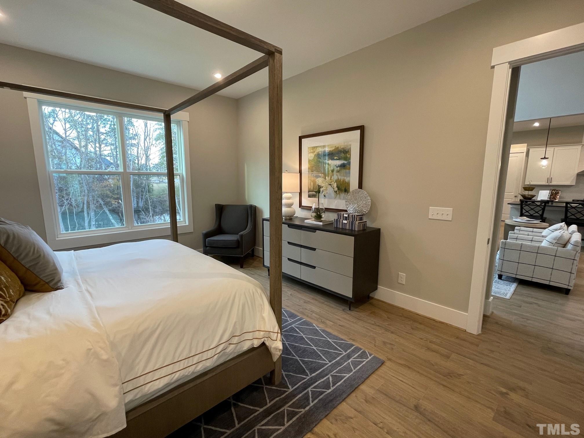 2017 Big Panther Drive Willow Spring, NC 27592 - Photo 17 of 35 a bedroom with a bed and a large window