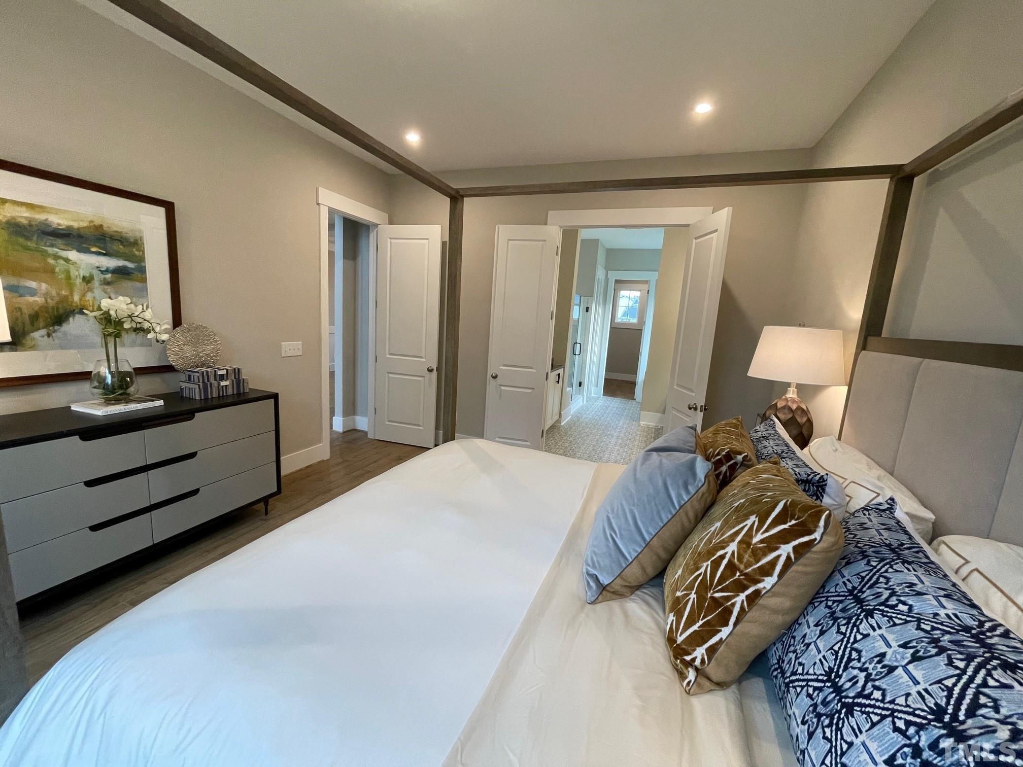 2017 Big Panther Drive Willow Spring, NC 27592 - Photo 19 of 35 a bed room with a bed and a mirror
