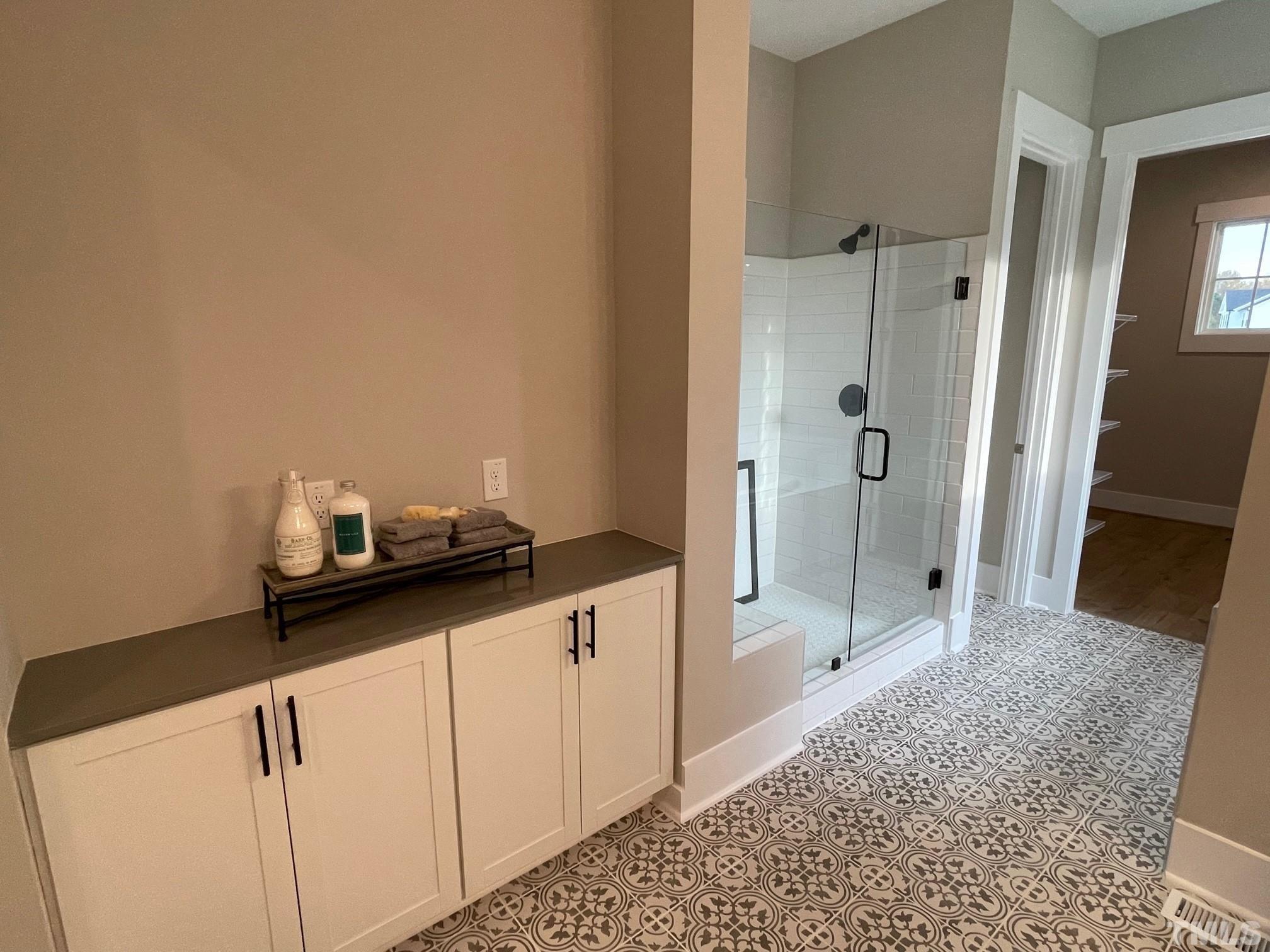 2017 Big Panther Drive Willow Spring, NC 27592 - Photo 21 of 35 a bathroom with a granite countertop sink a mirror and shower