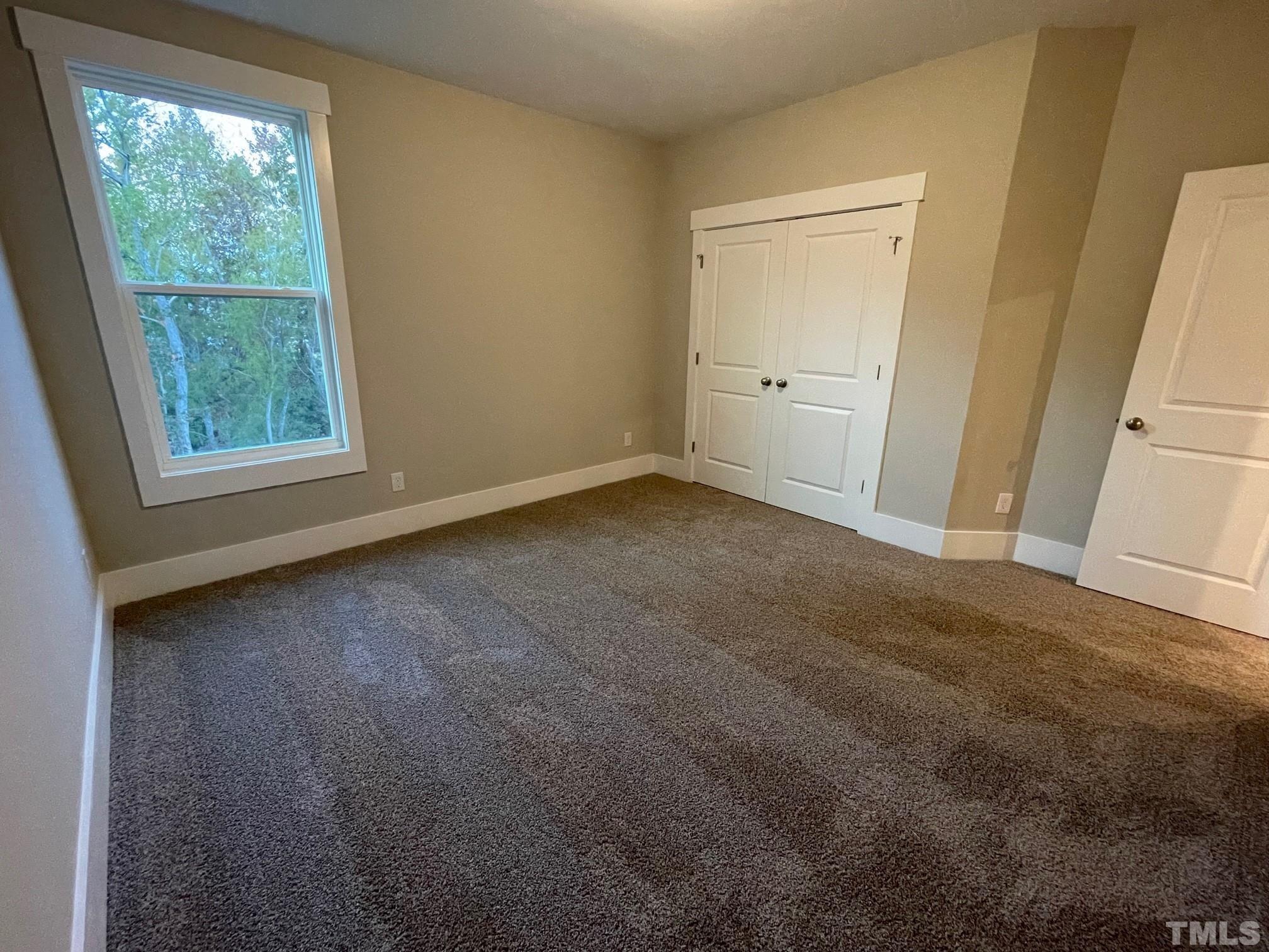 2017 Big Panther Drive Willow Spring, NC 27592 - Photo 31 of 35 an empty room with windows