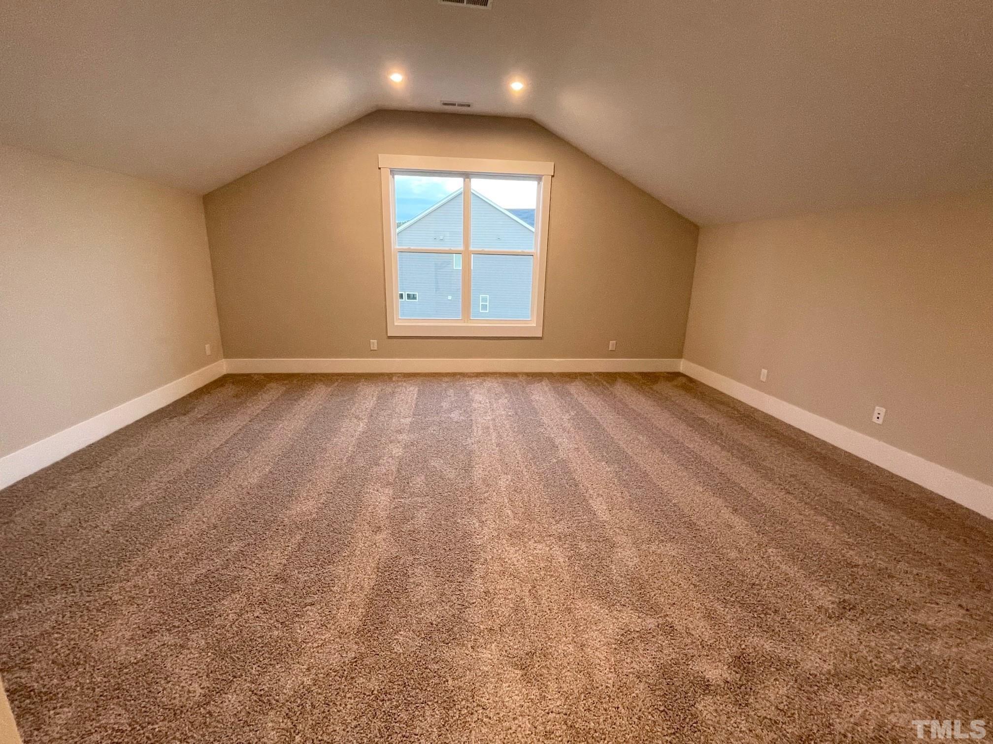 2017 Big Panther Drive Willow Spring, NC 27592 - Photo 33 of 35 an empty room with wooden floor and windows