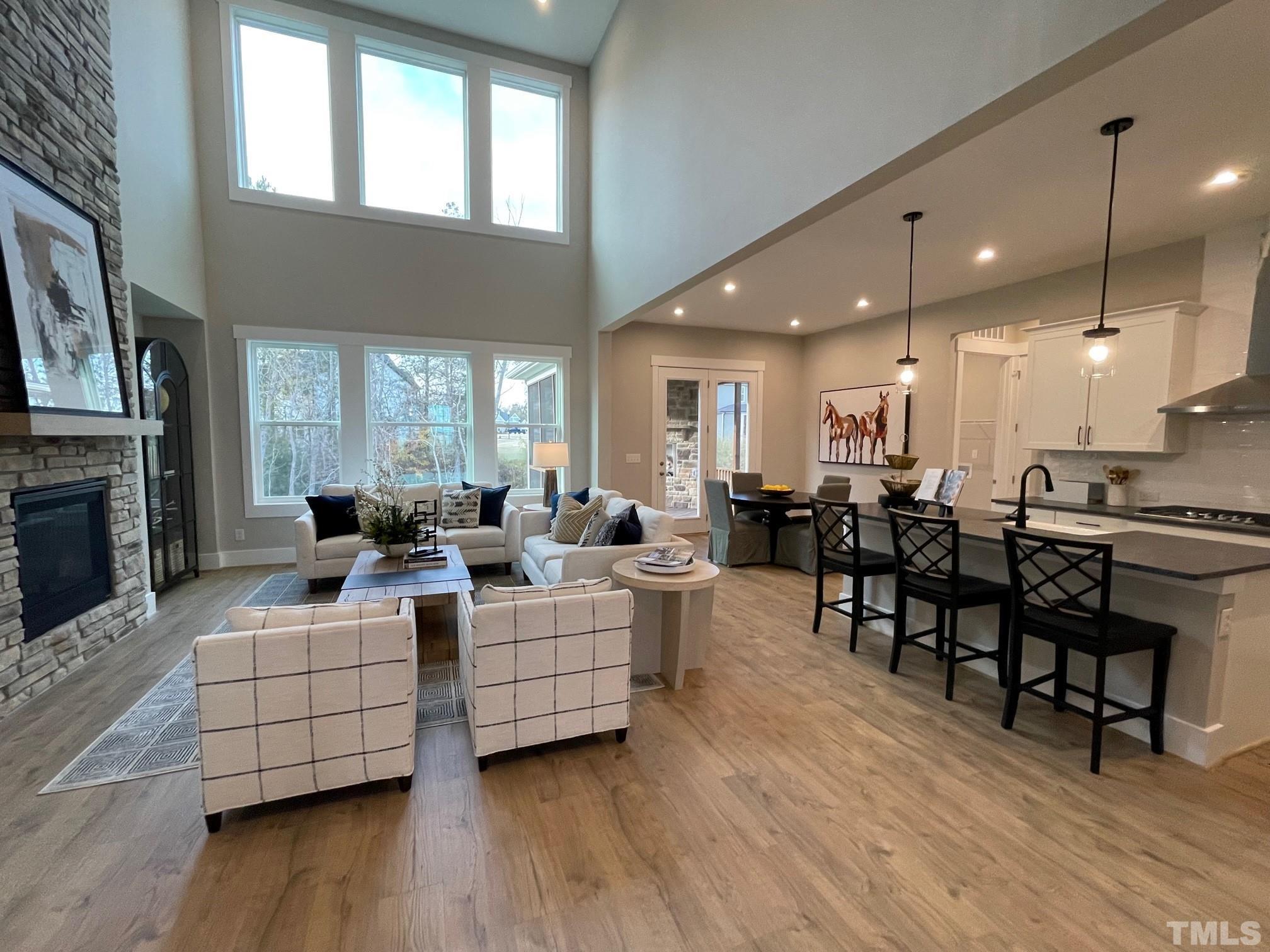 2017 Big Panther Drive Willow Spring, NC 27592 - Photo 7 of 35 a living room with furniture kitchen view and a wooden floor