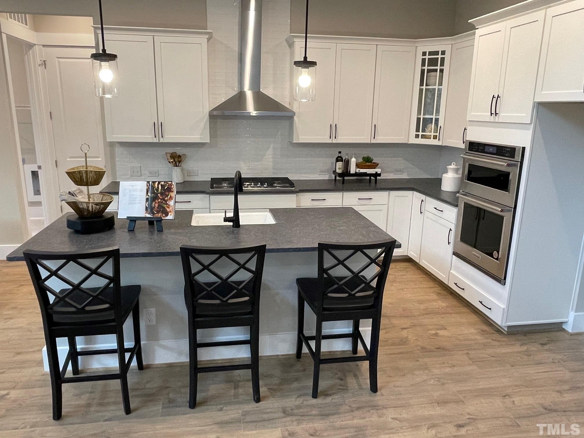 2017 Big Panther Drive Willow Spring, NC 27592 - Photo 10 of 35 a kitchen with a dining table and chairs