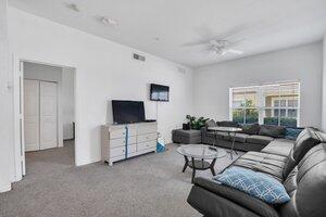 4563 Yellowgold Road East, Unit 107 Kissimmee, FL 34746 - Photo 2 of 22 Living room