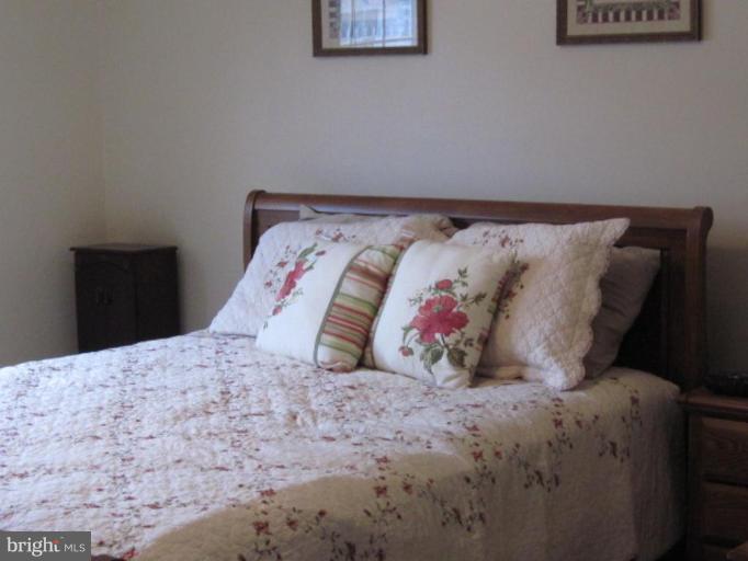 1918 Perryman Road Aberdeen, MD 21001 - Photo 12 of 25 a bed sitting in a bedroom and lamp