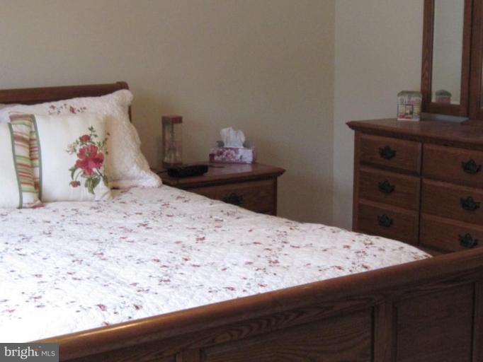 1918 Perryman Road Aberdeen, MD 21001 - Photo 13 of 25 a bedroom with a bed and a dresser