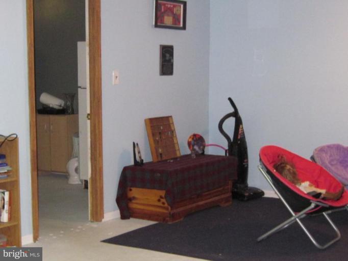1918 Perryman Road Aberdeen, MD 21001 - Photo 21 of 25 a bedroom with a bed and gym equipment