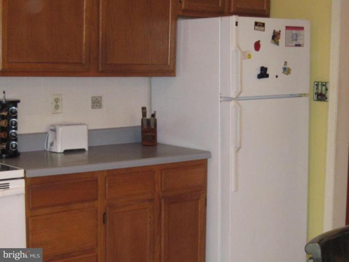 1918 Perryman Road Aberdeen, MD 21001 - Photo 10 of 25 a kitchen with a refrigerator and cabinets