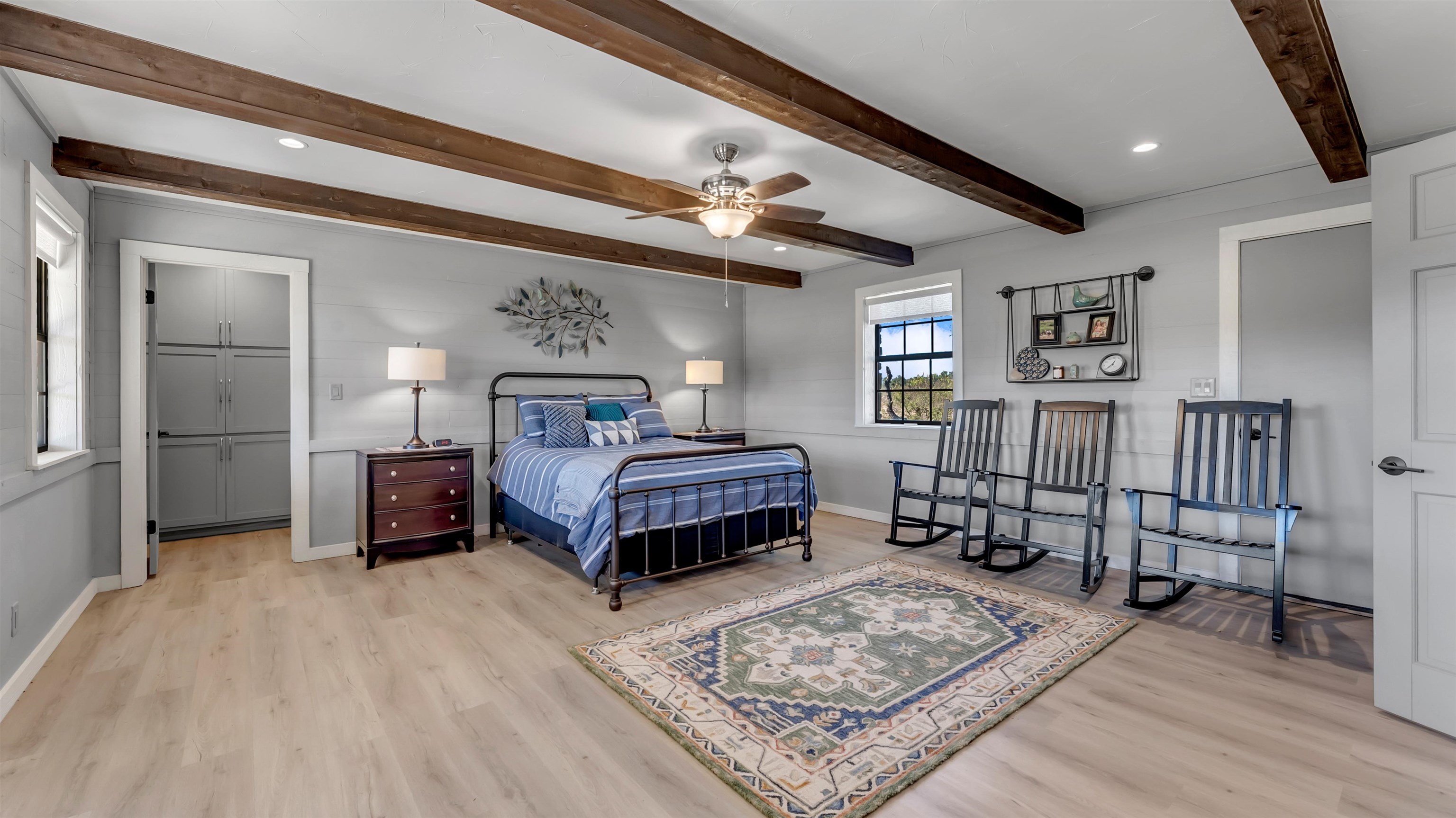 261 Diamond Cross Drive Llano, TX 78643 - Photo 16 of 30 a bedroom with a large bed a rug and chair