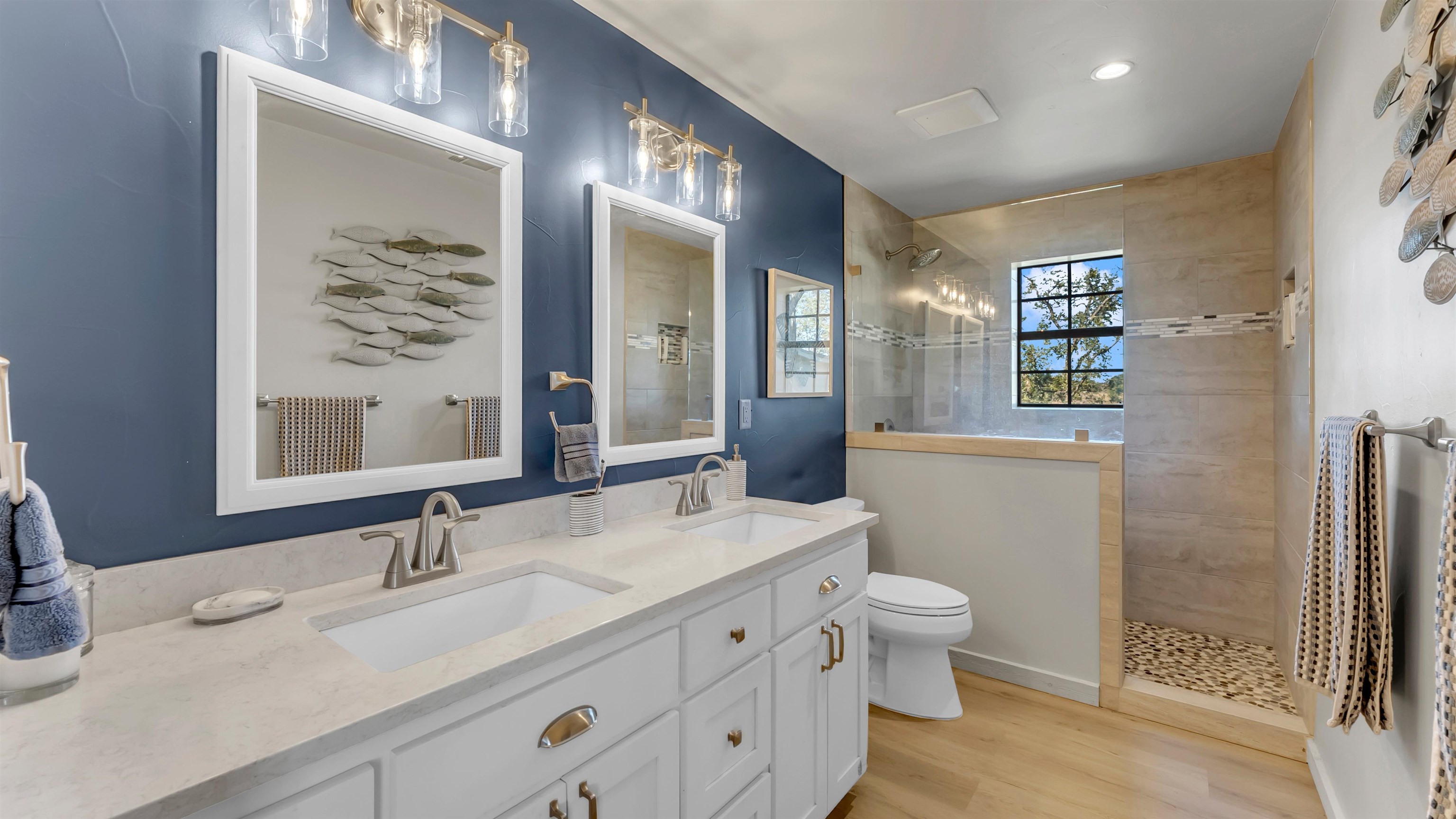 261 Diamond Cross Drive Llano, TX 78643 - Photo 17 of 30 a bathroom with a double vanity sink toilet and shower