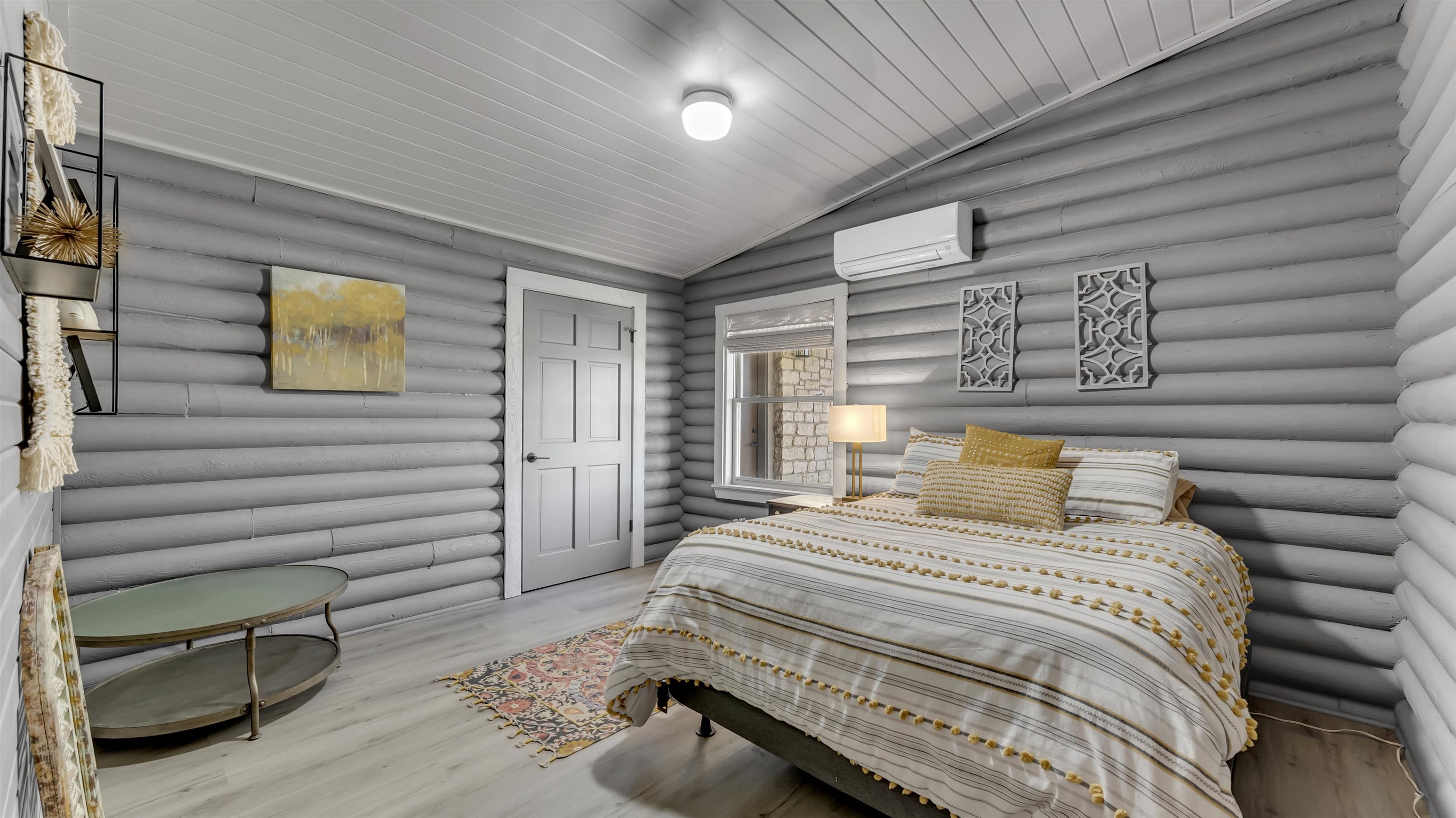 261 Diamond Cross Drive Llano, TX 78643 - Photo 18 of 30 a bedroom with a bed and a painting on the wall