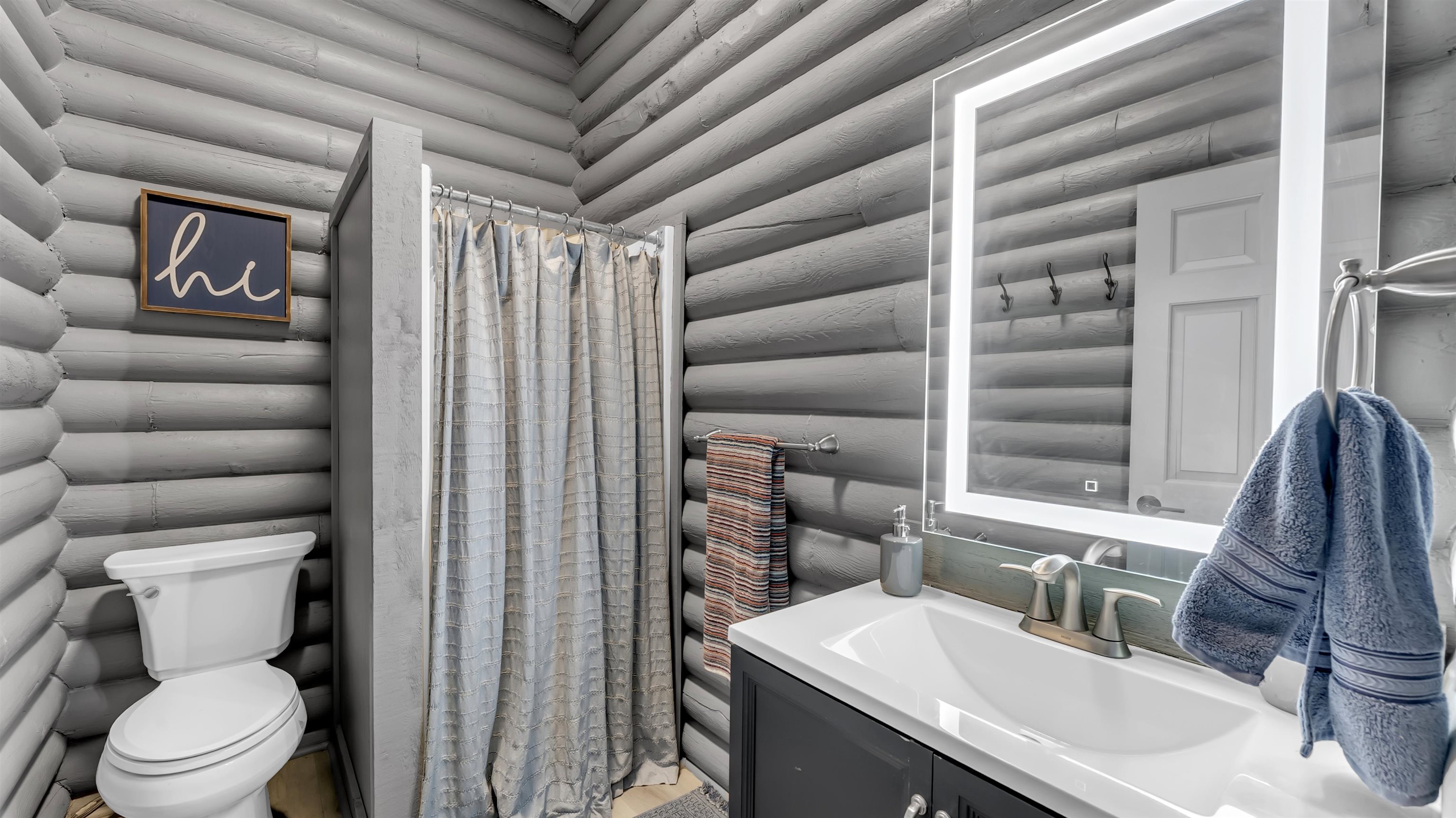 261 Diamond Cross Drive Llano, TX 78643 - Photo 20 of 30 a bathroom with a sink toilet vanity and shower