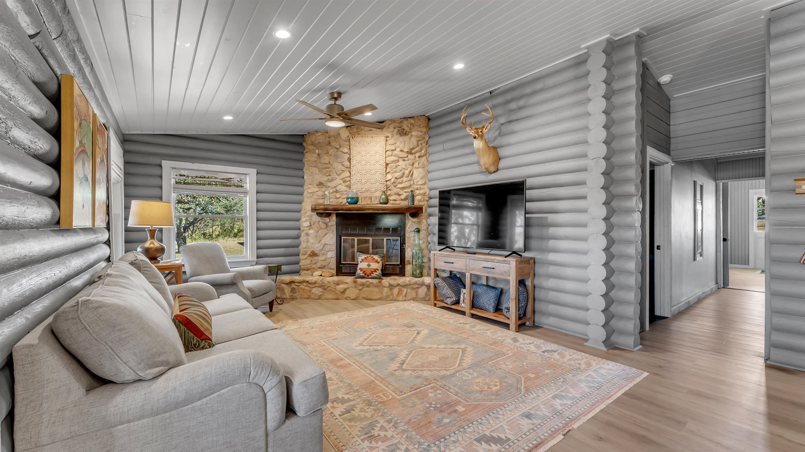 261 Diamond Cross Drive Llano, TX 78643 - Photo 22 of 30 a living room with furniture and a fireplace