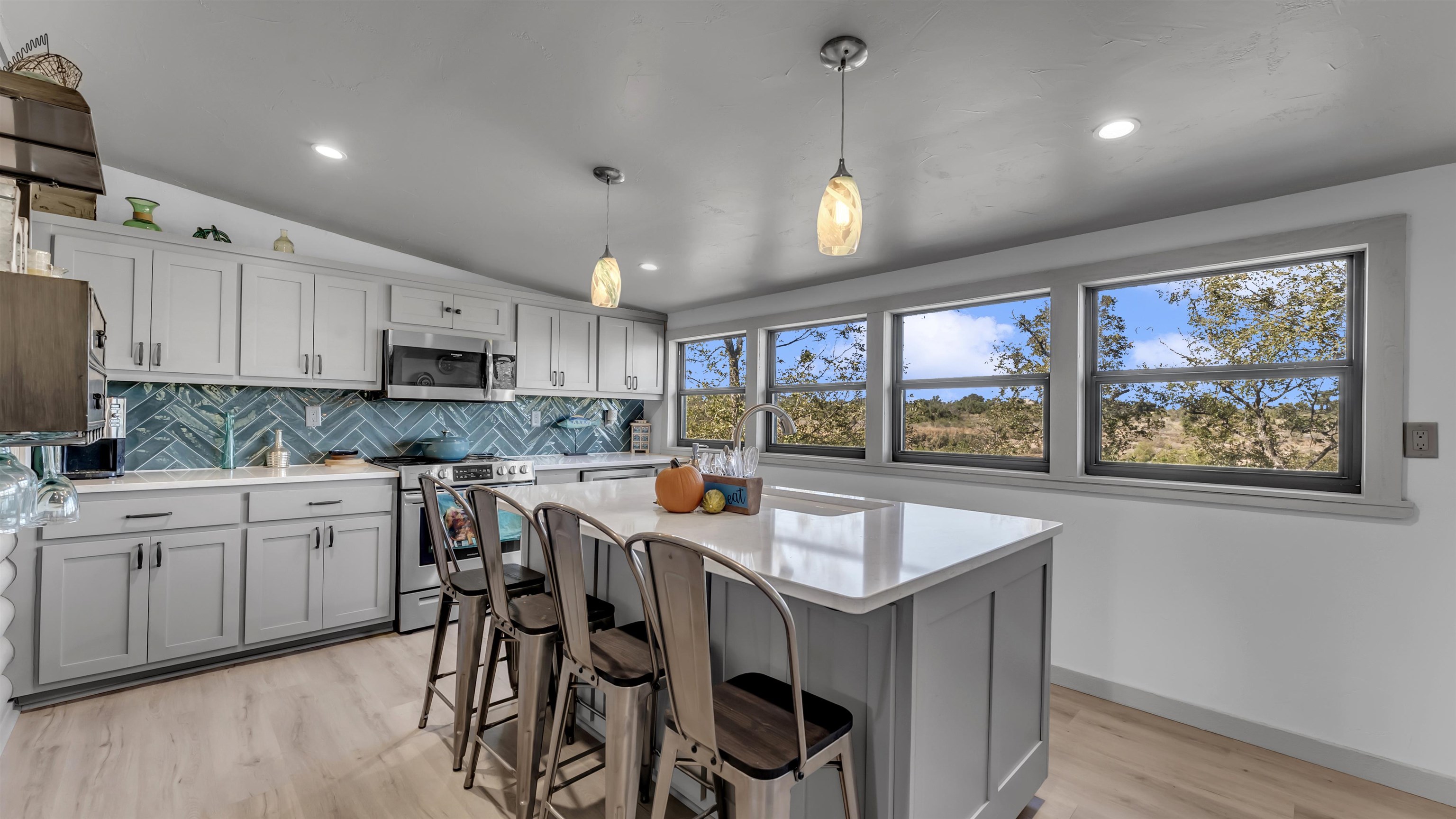 261 Diamond Cross Drive Llano, TX 78643 - Photo 24 of 30 a kitchen with stainless steel appliances granite countertop a table chairs sink and cabinets