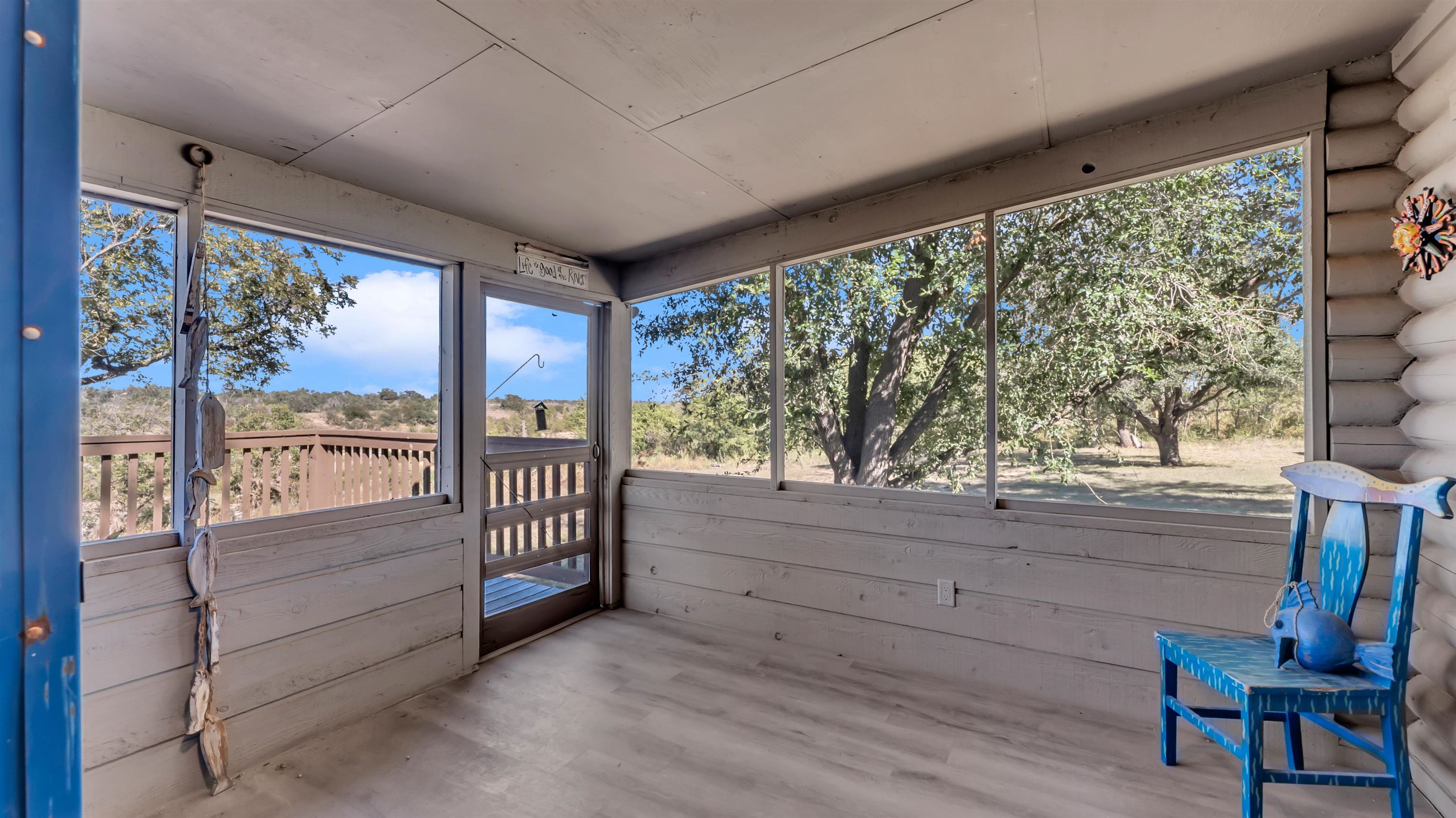 261 Diamond Cross Drive Llano, TX 78643 - Photo 29 of 30 a view of room with wooden floor and iron stairs