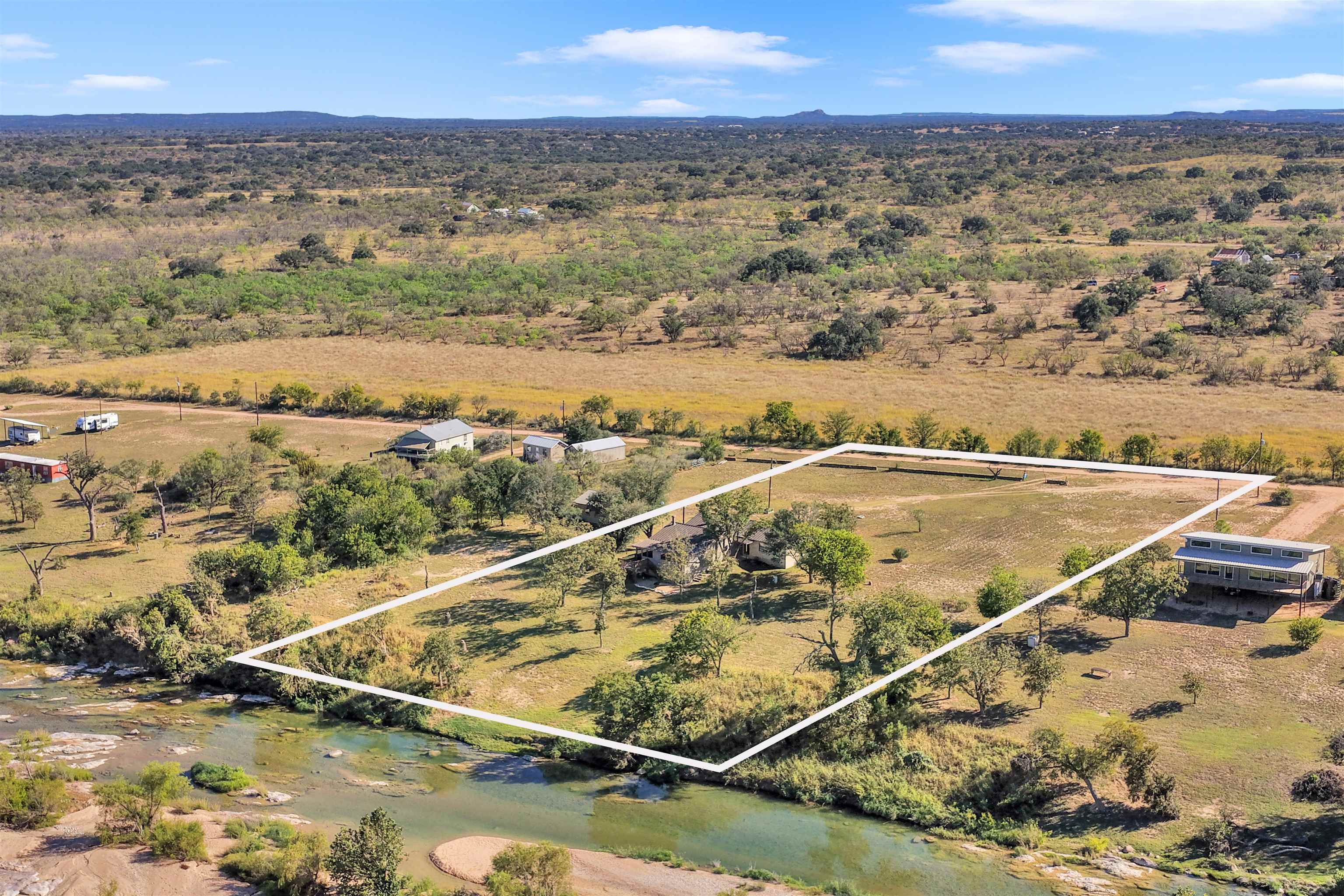 261 Diamond Cross Drive Llano, TX 78643 - Photo 3 of 30 an aerial view of residential houses with outdoor space