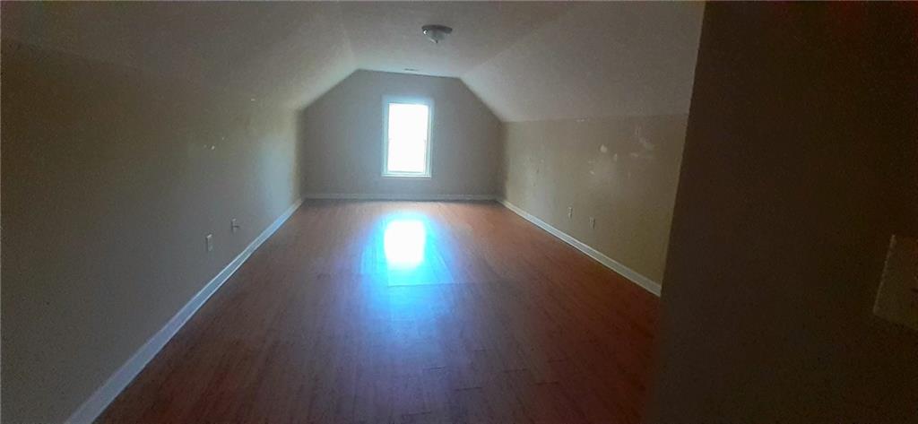 51 Pine Avenue Commerce, GA 30529 - Photo 21 of 24 a view of a room with wooden floor and windows
