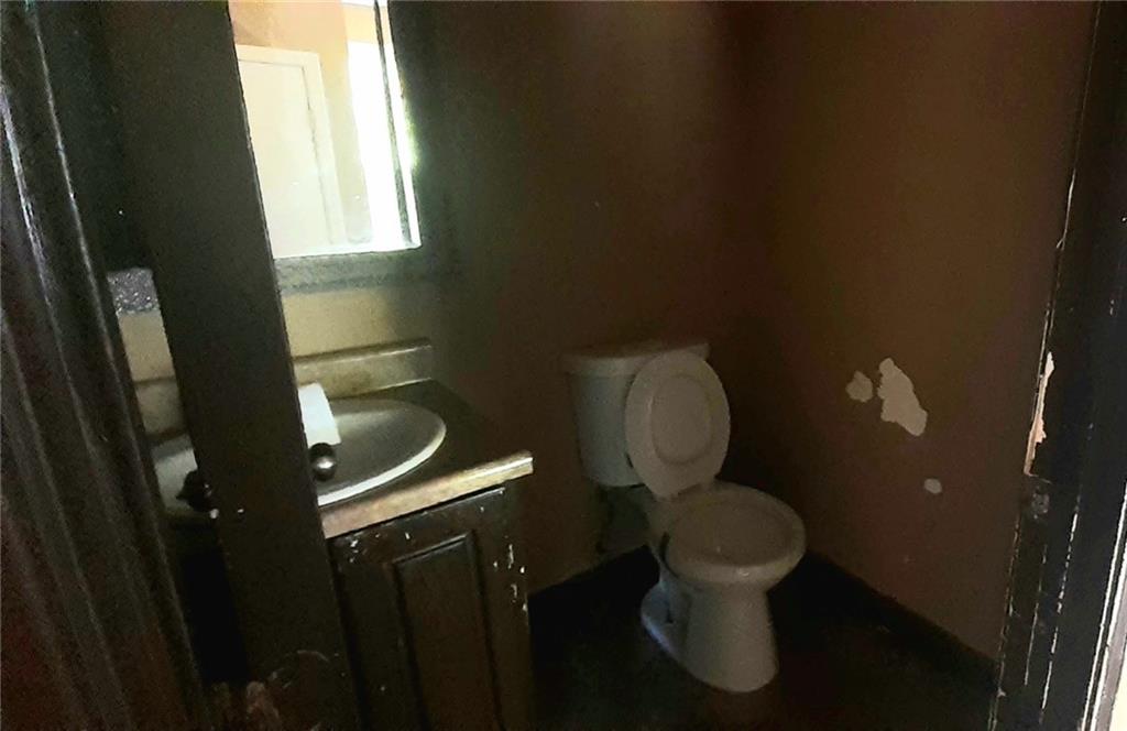 51 Pine Avenue Commerce, GA 30529 - Photo 9 of 24 a bathroom with a toilet and a sink