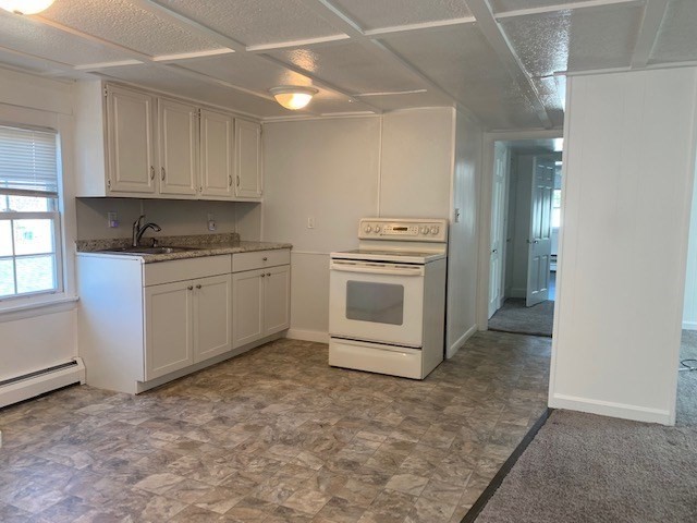 18 Taunton Street, Unit 2 Plainville, MA 02762 - Photo 3 of 15 a kitchen with stainless steel appliances granite countertop a stove a sink and a refrigerator