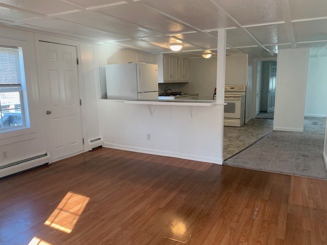 18 Taunton Street, Unit 2 Plainville, MA 02762 - Photo 6 of 15 a view of a kitchen with a sink and a window
