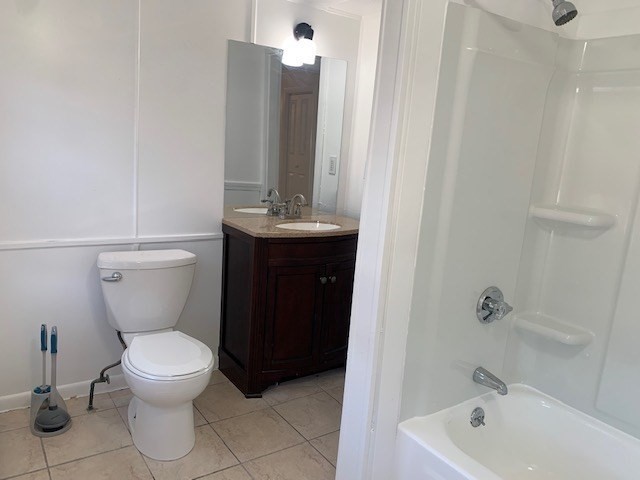 18 Taunton Street, Unit 2 Plainville, MA 02762 - Photo 9 of 15 a bathroom with a toilet sink and mirror