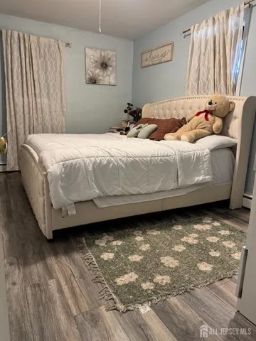 a bedroom with a bed and a cabinets