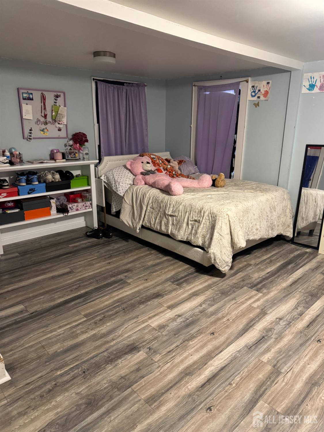 3350 Washington Road Parlin, NJ 08859 - Photo 15 of 18 a bedroom with a bed and a chandelier