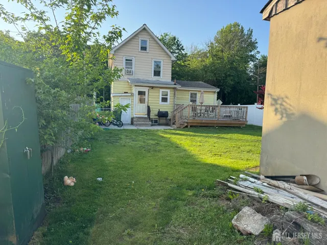 a view of a house with a yard balcony