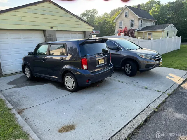 a car parked in front of a house