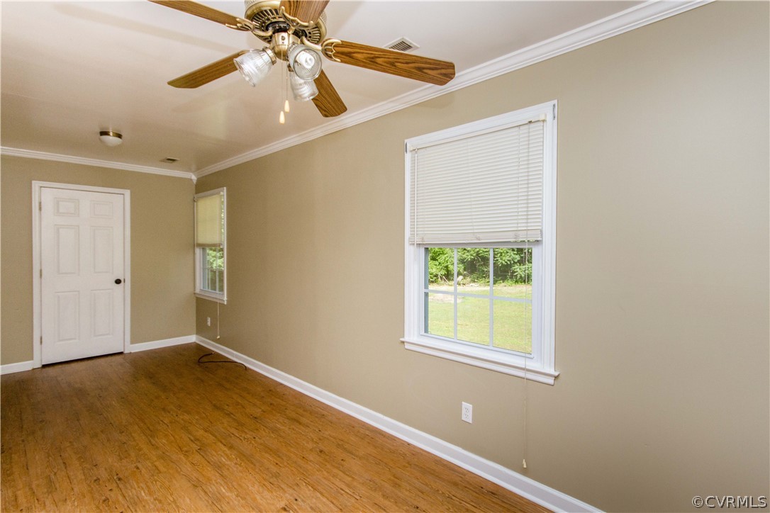 15514 Nash Road Dewitt, VA 23840 - Photo 11 of 23 an empty room with a window and a ceiling fan